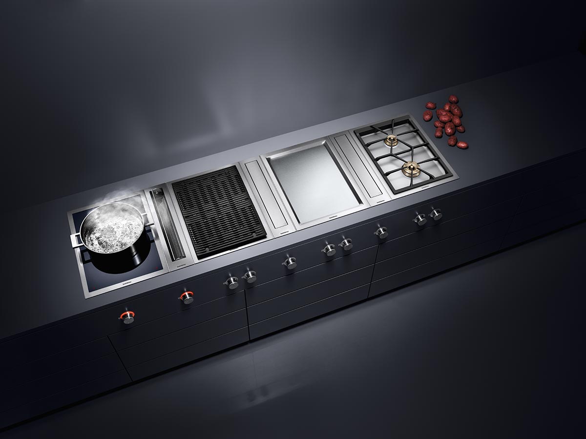 Great for small kitchens, a downdraft hood can be retracted into the cooking station for a neat and seamless kitchen. Image credit: Gaggenau