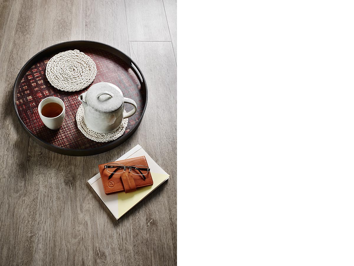 Featuring Criss cross driftwood tray, $165, Nordic sand stoneware mug, $10.95, Nordic sand stoneware teapot, $59.95 and Voyager Collection travel wallet, POA, all from HomesToLife