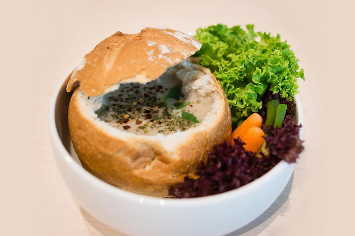 Come here to sup on comfort food like this hearty bread bowl. 