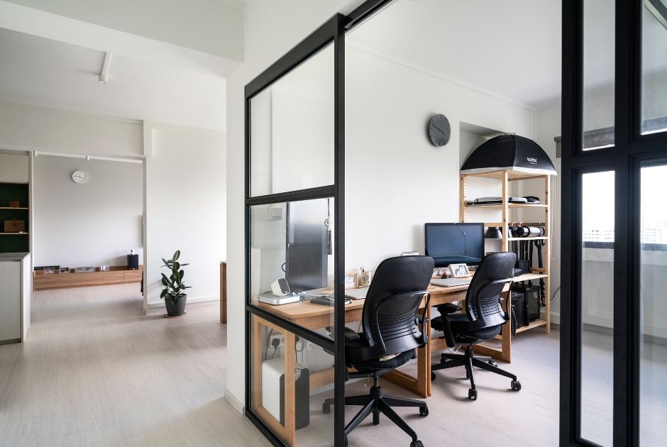 STUDY: Enclosed by metal sliding doors, this workspace extends seamlessly into the communal areas when the doors are open. 