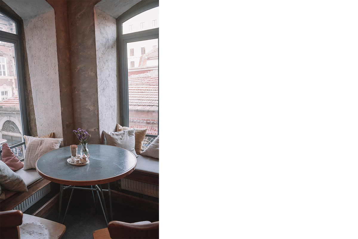 squarerooms-cafe-corner-cosy-home-window-seat-windowsill-round-metal-table