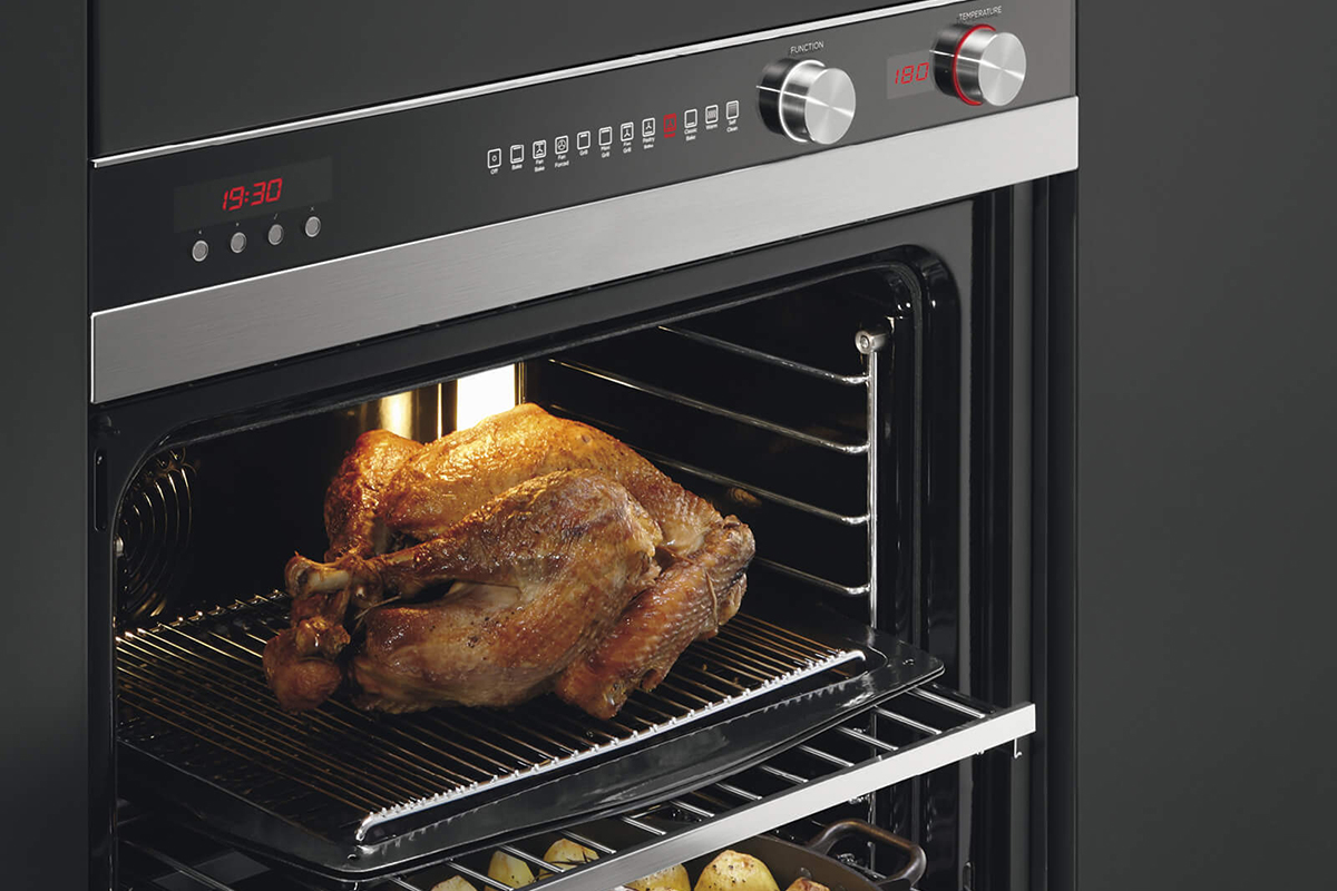 squarerooms fisher and paykel built in oven with chicken cooking inside
