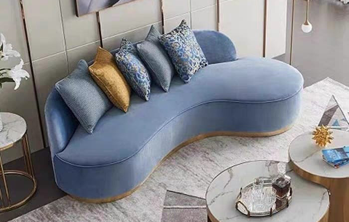 squarerooms blue couch sofa rounded curved living room yellow cushion