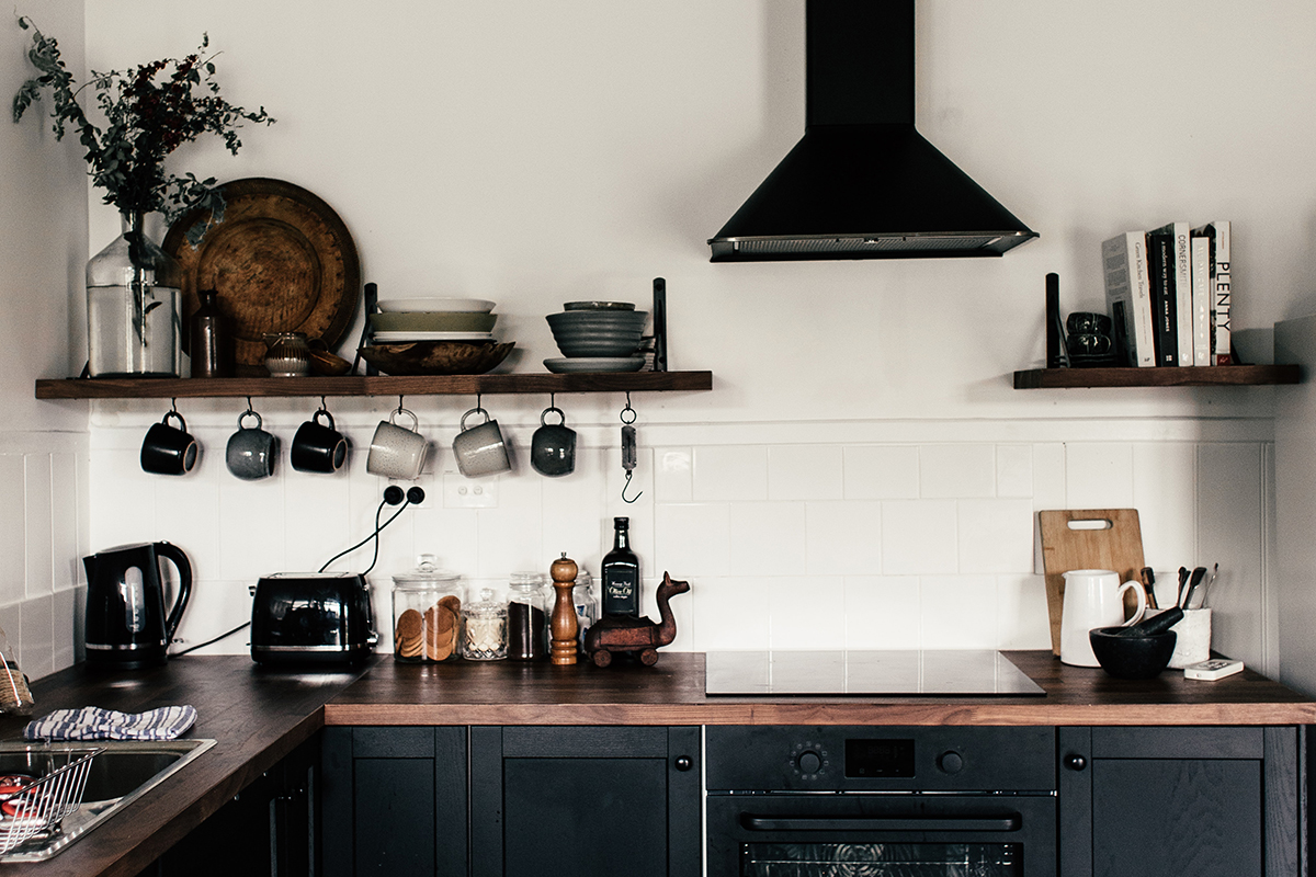rachel-claire squarerooms dark black kitchen wooden countertop rustic industrial cooker hood
