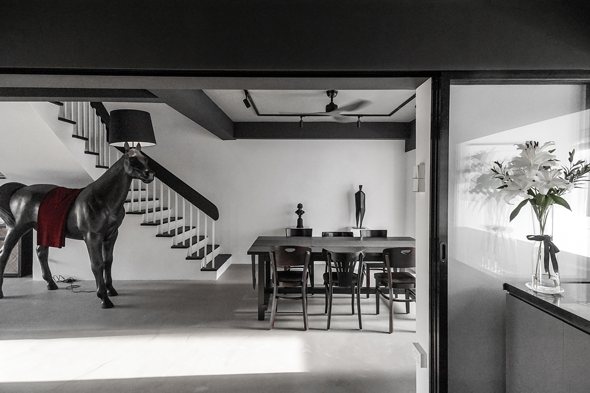 squarerooms versify studio architecture interior design home inspo house tour landed property monochromatic black and white modern designer horse lamp dining room area table stairs staircase front moooi
