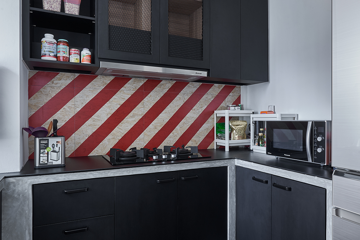 squarerooms ju design studio home budget renovation dark black grey monochromatic industrial kitchen red backsplash