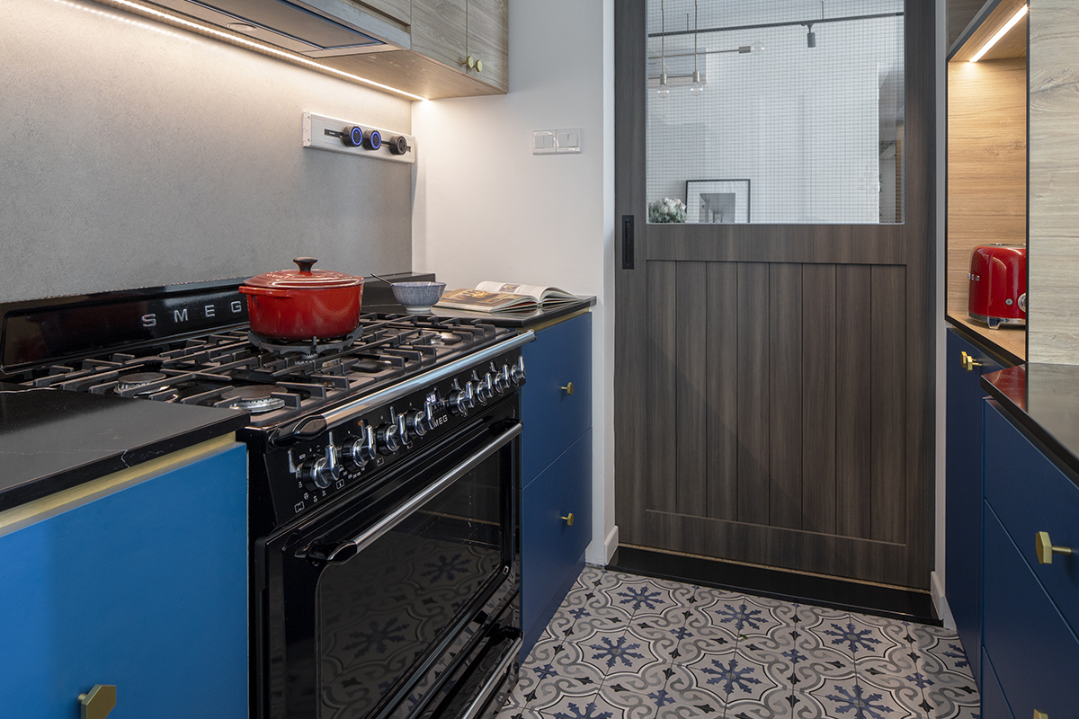 squarerooms d'marvel scale condominium home renovation modern eclectic interior design peranakan tiles kitchen floor blue cabinets red pots cookware