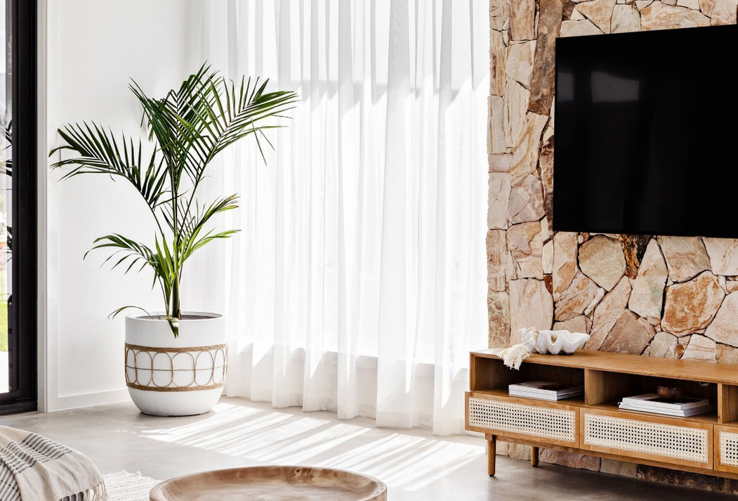 Oak and Orange The Palm Co living room rock wall feature tv neutral minimalist desert style warm