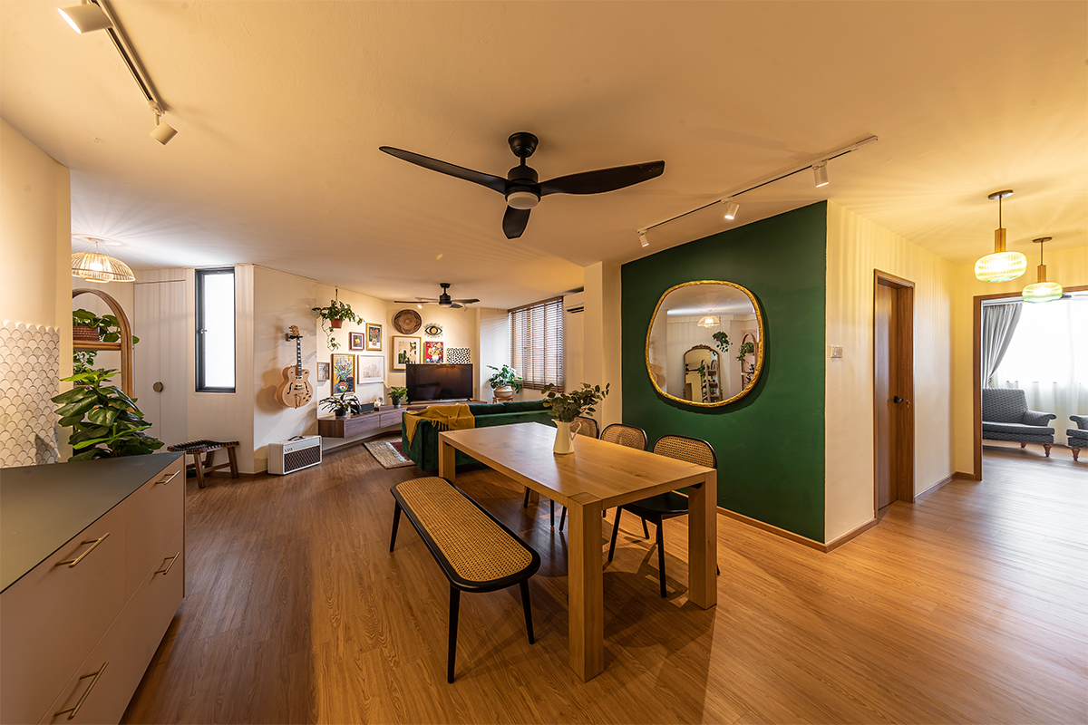 squarerooms swiss interior home renovation 4A 4 room hdb resale flat eclectic style design look makeover cosy living dining room area open space concept green feature wall mirror warm inviting wood floors