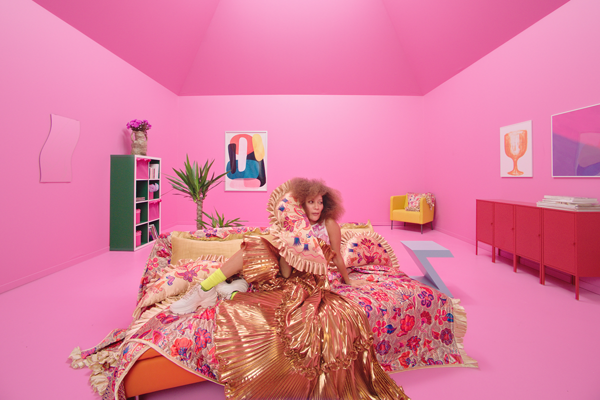 squarerooms ikea karismatik collection bold colourful home decor pink bright woman on bed sitting patterns