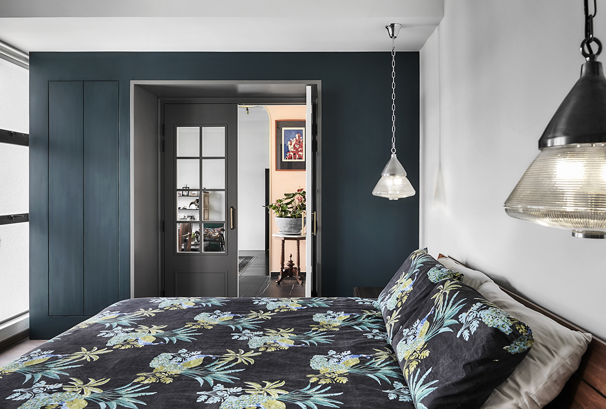 squarerooms linear space concepts eclectic colourful home interior design singapore east coast walk up apartment style maximalist bold vintage look bedroom dark blue wall bedding bed sheets patterned