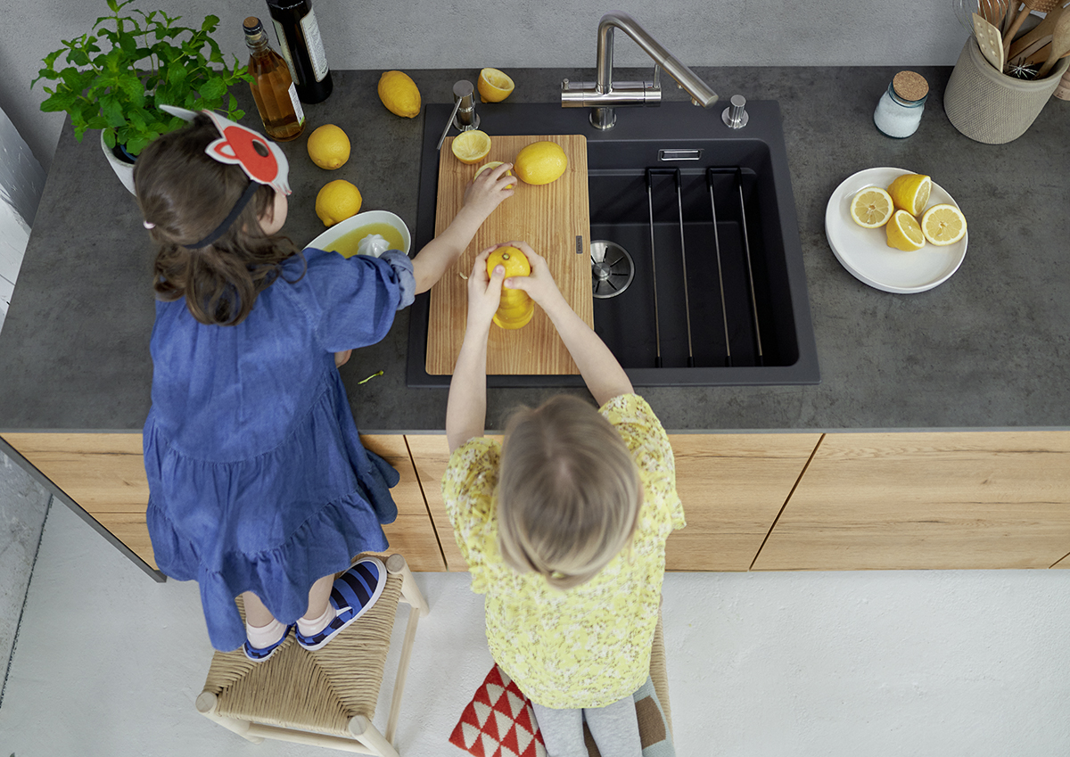 squarerooms blanco kitchen fontas ii water filter sink children washing hands chopping fruits cutting board countertop