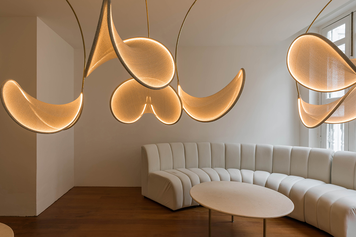 squarerooms sol luminaire galerie 5 lighting showroom new high end shop opening singapore minimalist luxury living room white curved sofa