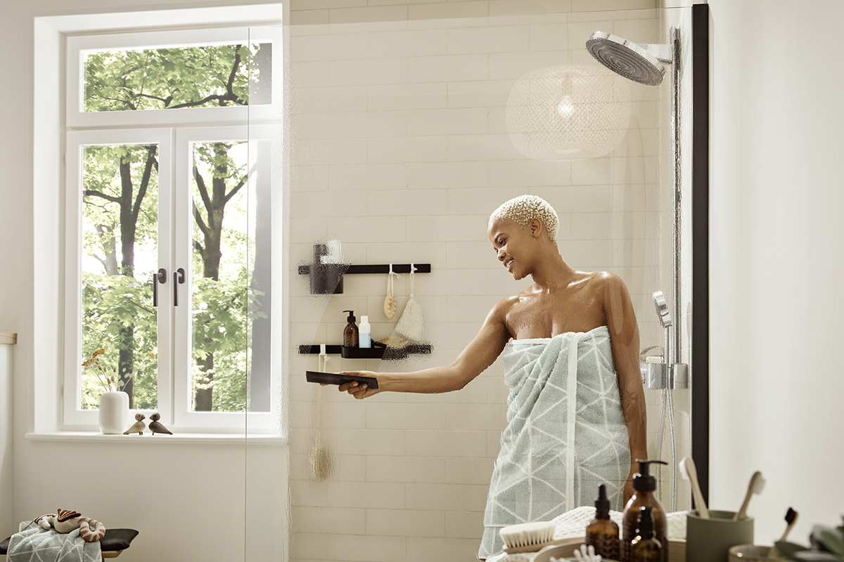 squarerooms hansgrohe wallstoris bathroom accessories woman in shower towel