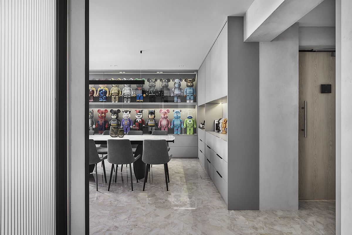 squarerooms style elements home renovation executive hdb flat in tampines modern design luxury apartment design black and white monochrome monochromatic aesthetic singapore dining room area bearbrick display