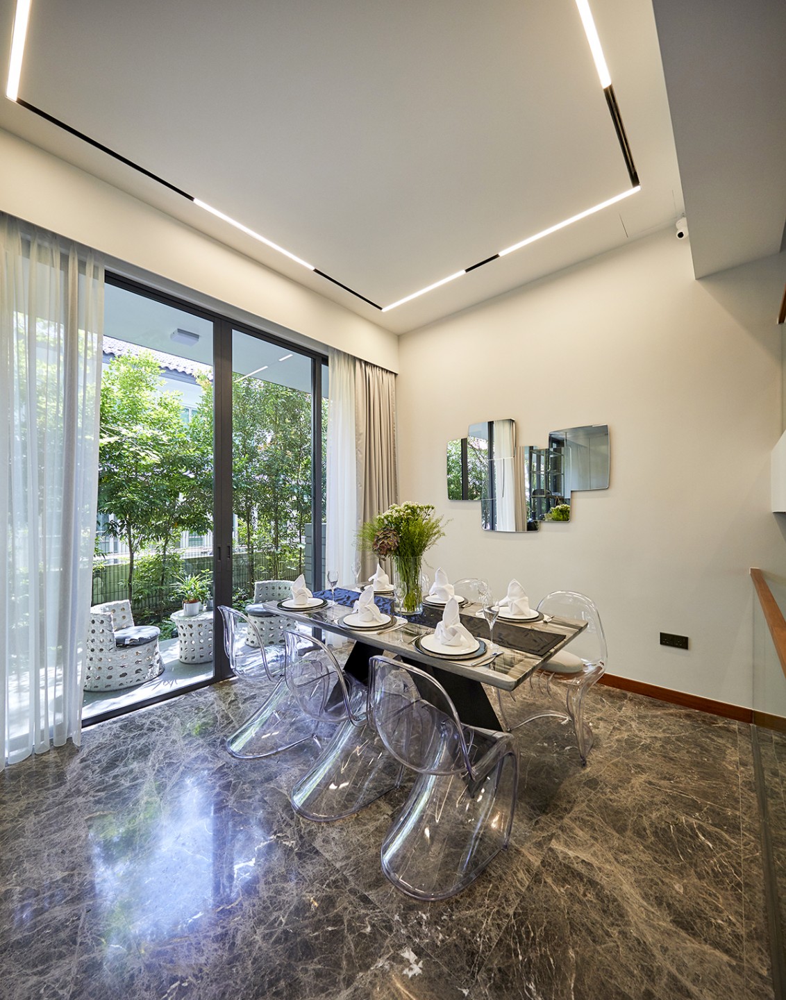 squarerooms i-chapter home design terraced house interior singapore luxury design dining room glass chairs see-through clear modern futuristic furniture