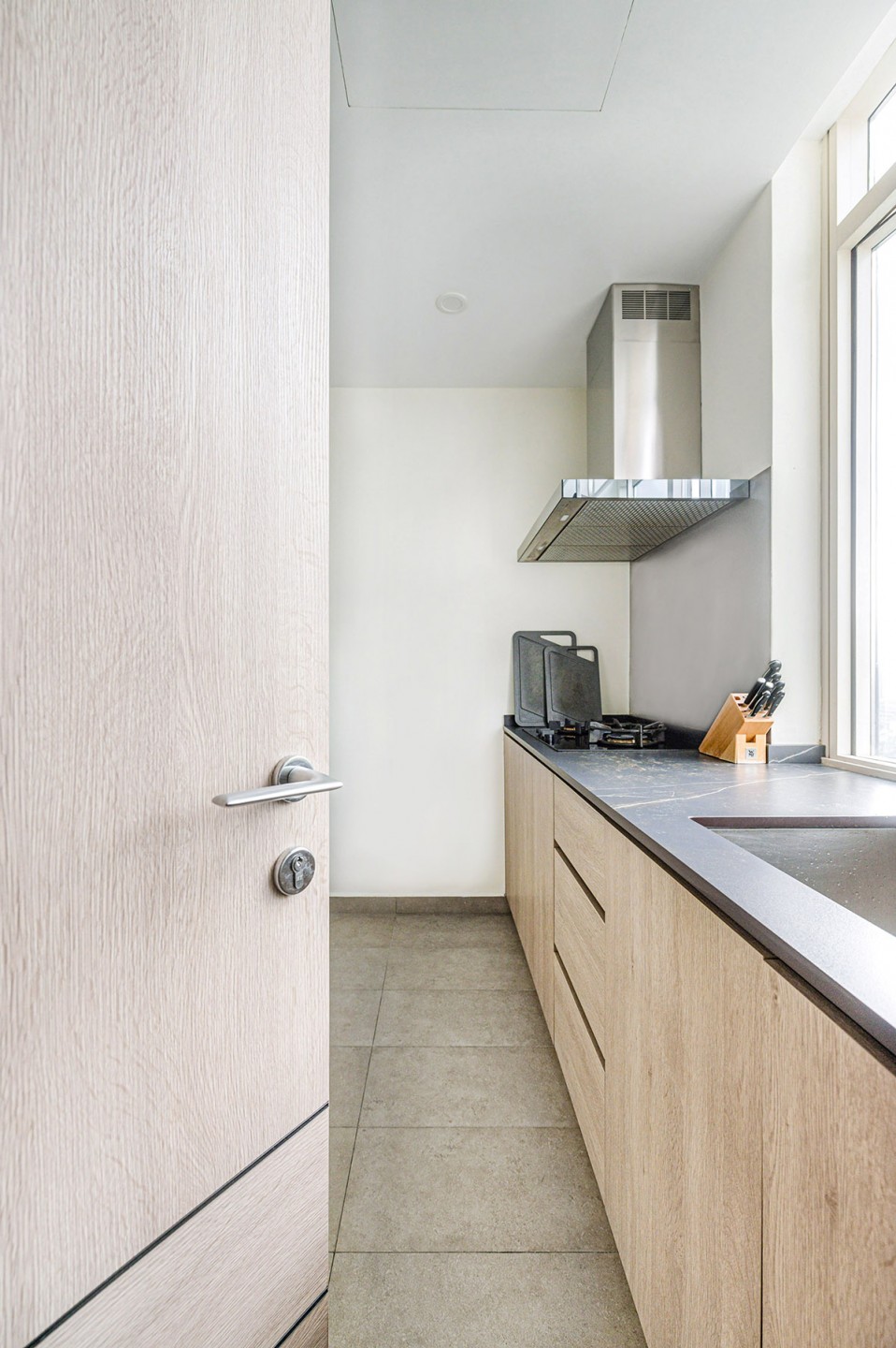 squarerooms v-zug vzug kitchen renovation homeowners interview appliances grey neutral colour palette design style open concept island wood cabinets cooker range hood