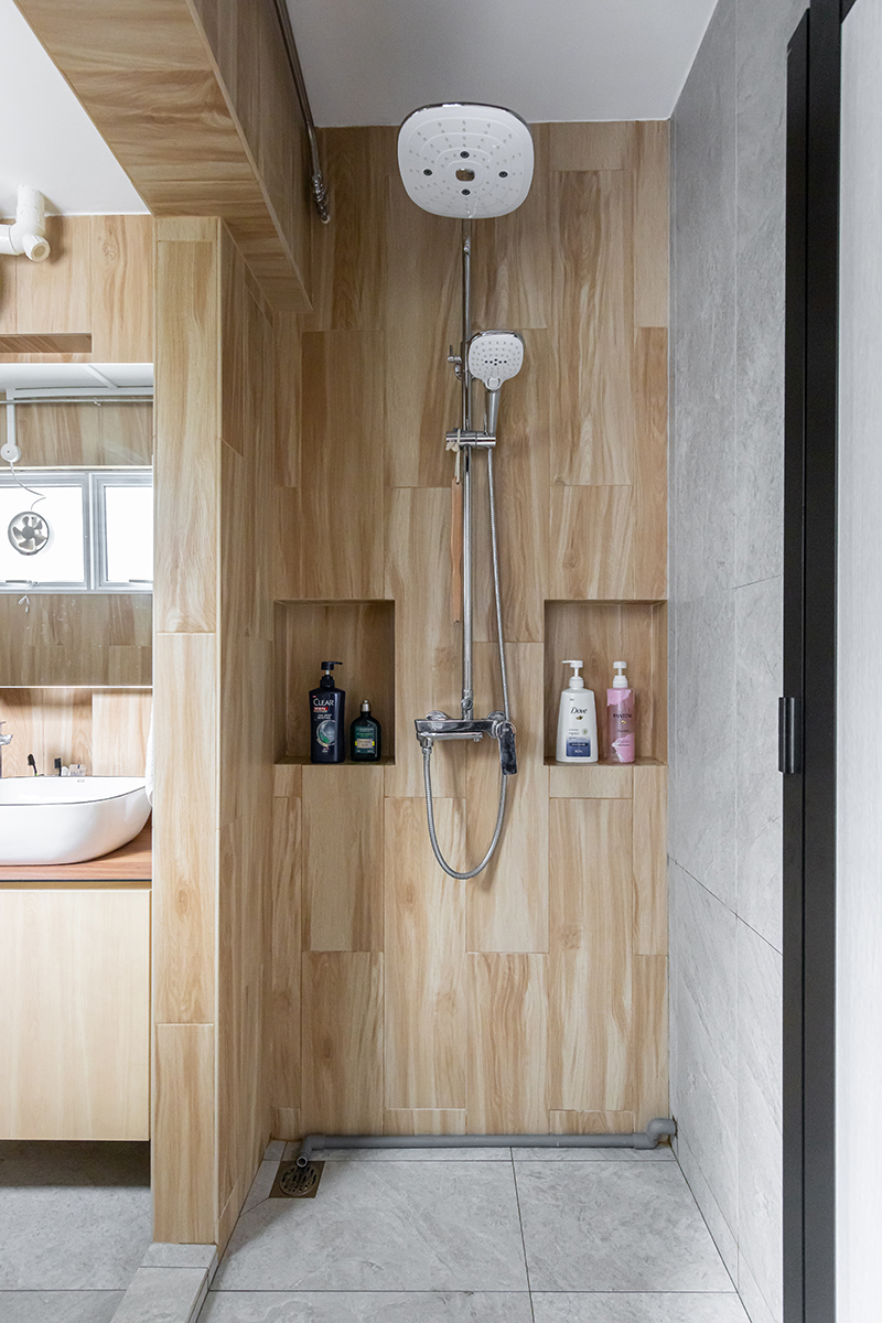 squarerooms renozone interior design home renovation jumbo hdb flat makeover modern style bathroom shower wood tiles