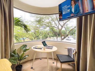 coliwoo orchard service apartment singapore alcove studio round curved window balcony studio room